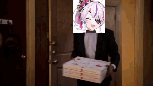 a man in a tuxedo is holding a stack of pizza boxes with a picture of a girl on his face .