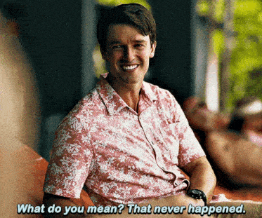 a man in a hawaiian shirt is smiling and asking what do you mean that never happened .