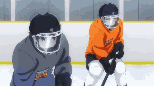 two ice hockey players wearing helmets and sweatshirts that say ' dream boys ' on them