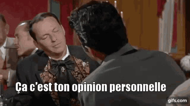 a man in a suit is talking to another man with the words ca c'est ton opinion personnelle written below him