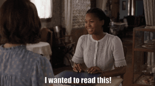 a woman is sitting at a table with another woman and says i wanted to read this