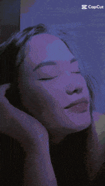 a woman with her eyes closed is being animated with the capcut app