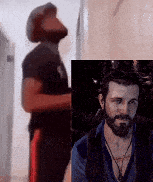 a man with a beard is standing next to a picture of a man with a beard