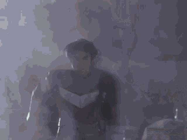a man in a superhero costume is running through a dark room .