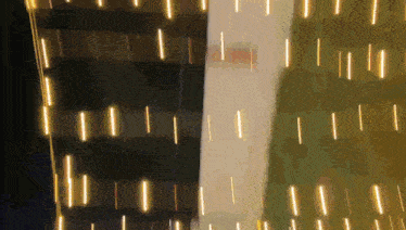 a blurred image of a building with lights on it