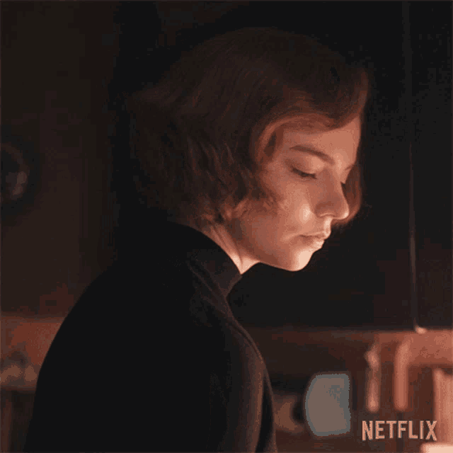 a close up of a woman 's face with the word netflix on the bottom