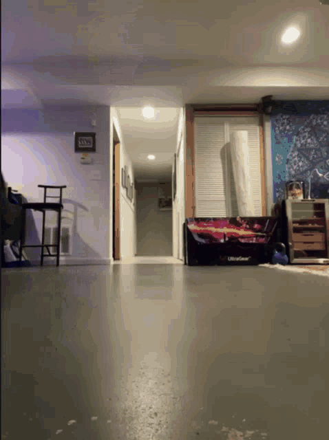 a living room with a couch and a sign that says ' i love you ' on the wall