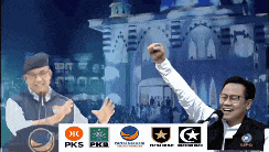 a man with a fist in the air stands in front of a podium with pks and pkb logos