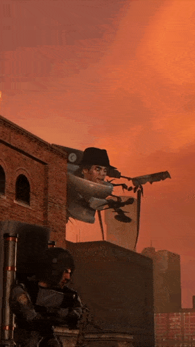 a man in a cowboy hat holds a gun in front of a brick building