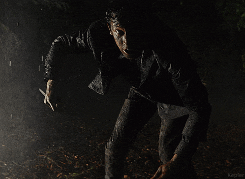 a man in a dirty shirt is screaming in the rain with the word kepler in the bottom right corner