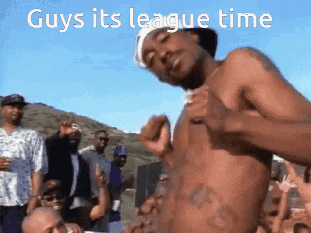 a shirtless man stands in front of a crowd with the words guys its league time on the bottom
