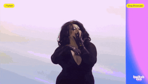 a woman is singing into a microphone on a purple and pink background .