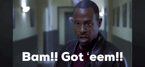a man in a leather jacket is standing in a hallway and says `` bam ! got ' eem ! ''