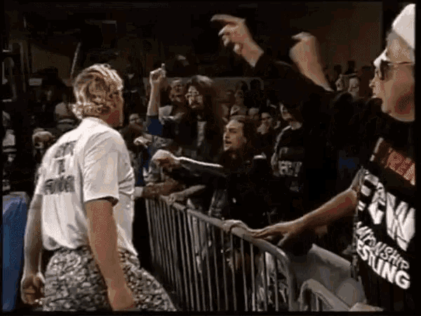 a man wearing a shirt that says midwest wrestling