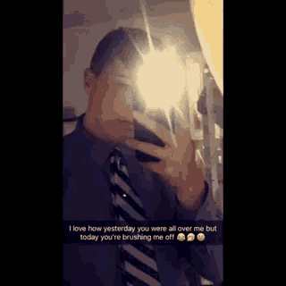 a man taking a picture of himself in the mirror