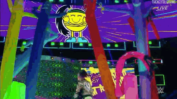 a woman is standing in front of a cartoon character on a stage