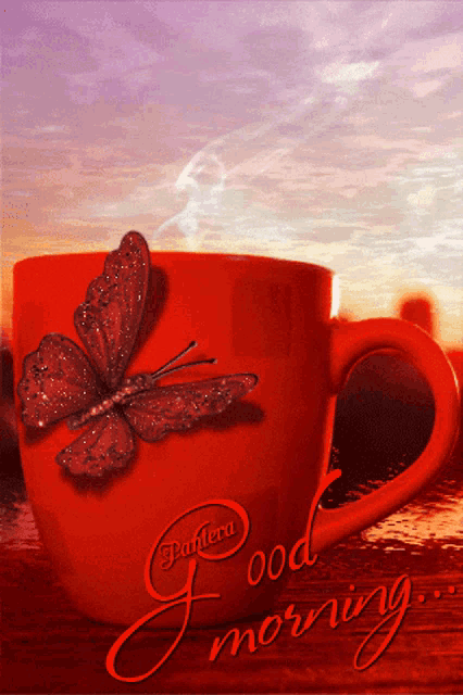 a red coffee cup with a butterfly on it and the words good morning