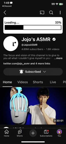 a screenshot of jojo 's asmr shows a man holding a head massager
