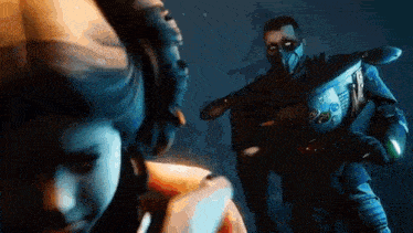 a man in a mask is standing in front of a woman in a video game .
