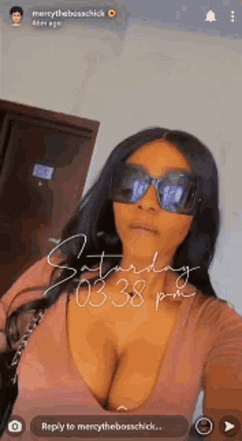 a woman wearing sunglasses is taking a selfie on saturday at 0:38 pm