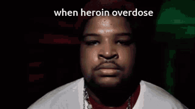 a close up of a man 's face with the words `` when heroin overdose '' on the bottom .