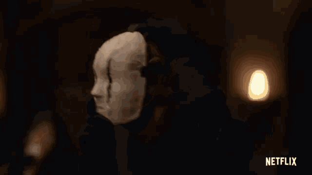 a woman is wearing a mask on her head and a netflix logo is visible in the corner .