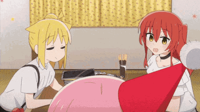 two anime girls are sitting at a table and one has a red hat on