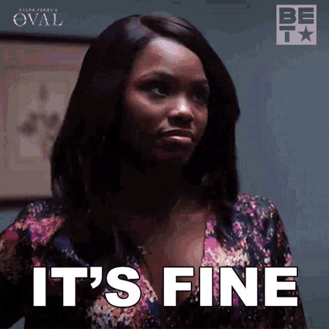 a woman says it 's fine while wearing a floral shirt