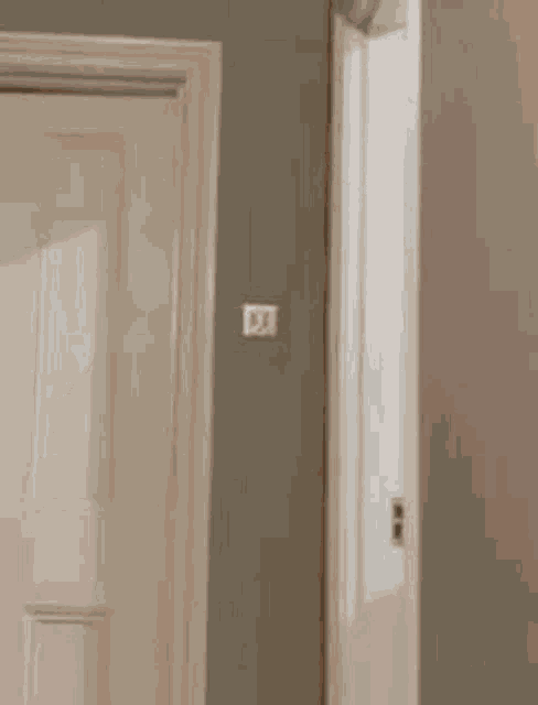 a woman 's leg is sticking out of a door while holding a key .