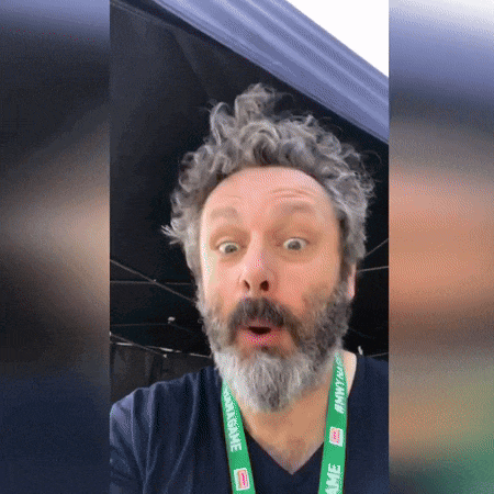 a man with a beard has a lanyard around his neck that says awesome