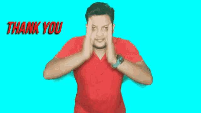 a man in a red shirt says thank you with his hands together
