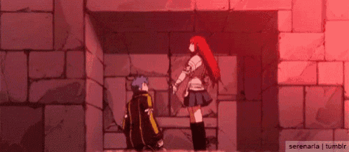 a man and a woman are standing next to each other in a room .