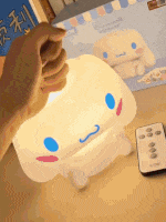 a person is holding a light that looks like a stuffed animal