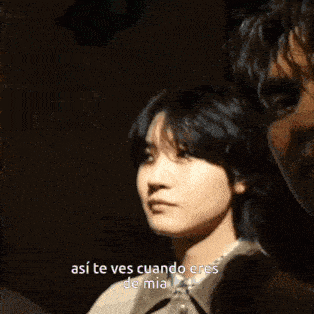 a man and a woman are standing next to each other with the woman saying " asi te ves cuando eres de mia "