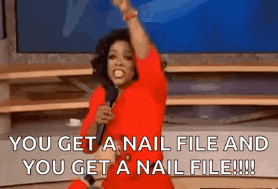 a woman in a red dress is holding a microphone and screaming .