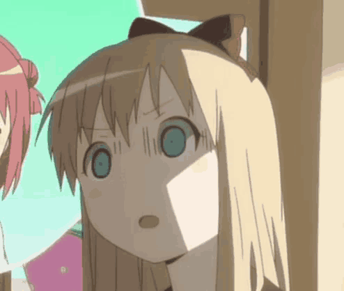 a cartoon girl with blonde hair and blue eyes looks surprised