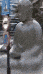 a blurry picture of a statue with a sign in the background that says do not enter