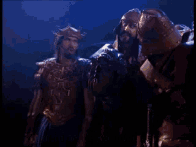 a group of men in armor are standing next to each other with the words when in battle keep your head