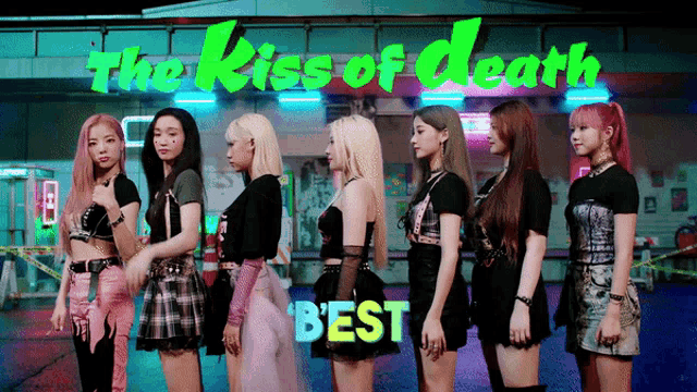a group of girls stand in front of a sign that says the kiss of death best