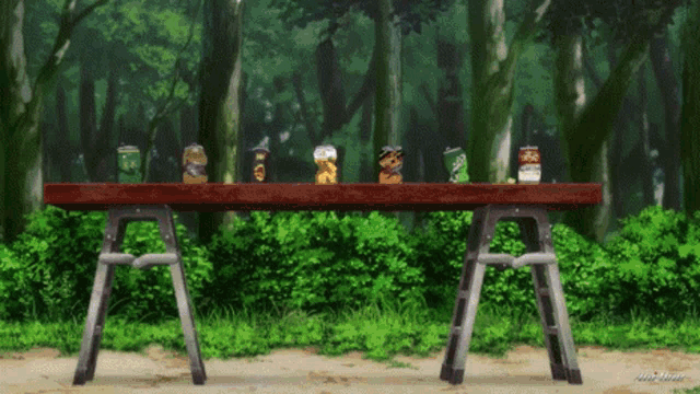 several cans of pringles sit on a wooden table in a forest
