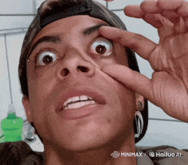 a close up of a person 's face with a watermark that says minimax