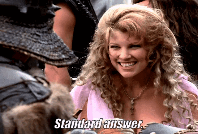 a woman in a pink dress is smiling with the words standard answer behind her