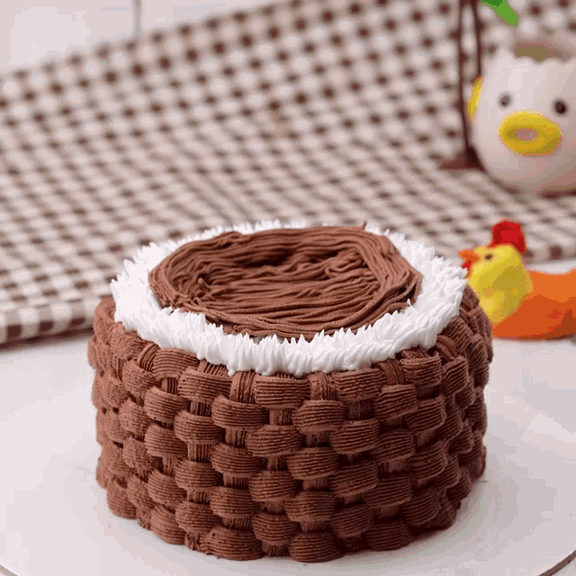 a chocolate cake with white frosting on top