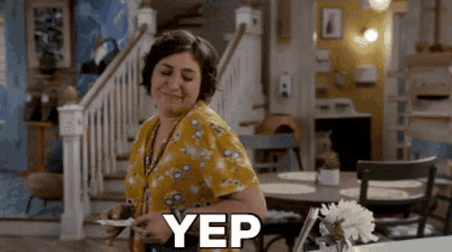 a woman in a yellow shirt says yep while holding a plate of food