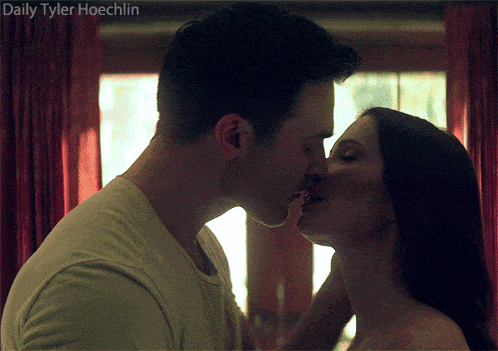 a picture of a man and woman kissing with daily tyler hoechlin in the bottom right corner