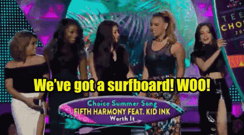 a group of girls standing next to each other with a sign that says we 've got a surfboard woo !