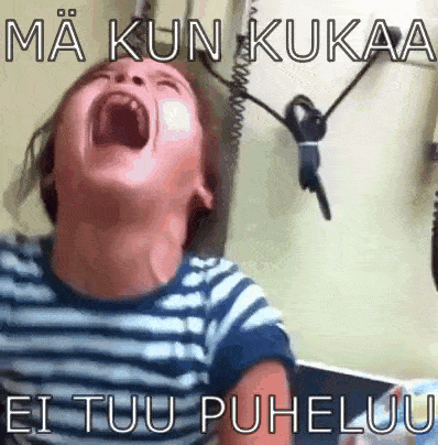 a young boy is screaming with his mouth open and the words ma kun kukaa ei tuu puheluu written above him .