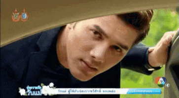 a man is looking out of a car window with a banner that says ' hd ' on it