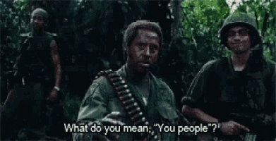 a group of soldiers are standing in the woods and one of them is asking what do you mean you people