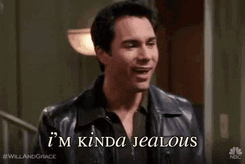 a man in a leather jacket is talking to another man and says `` i 'm kinda jealous '' .